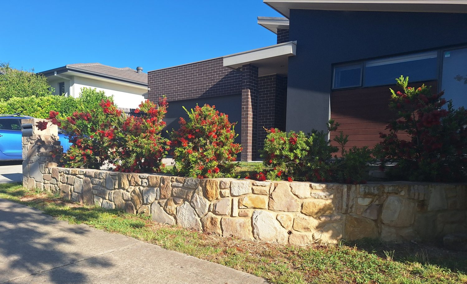 Sandstone retaining wall and Letterbox feature